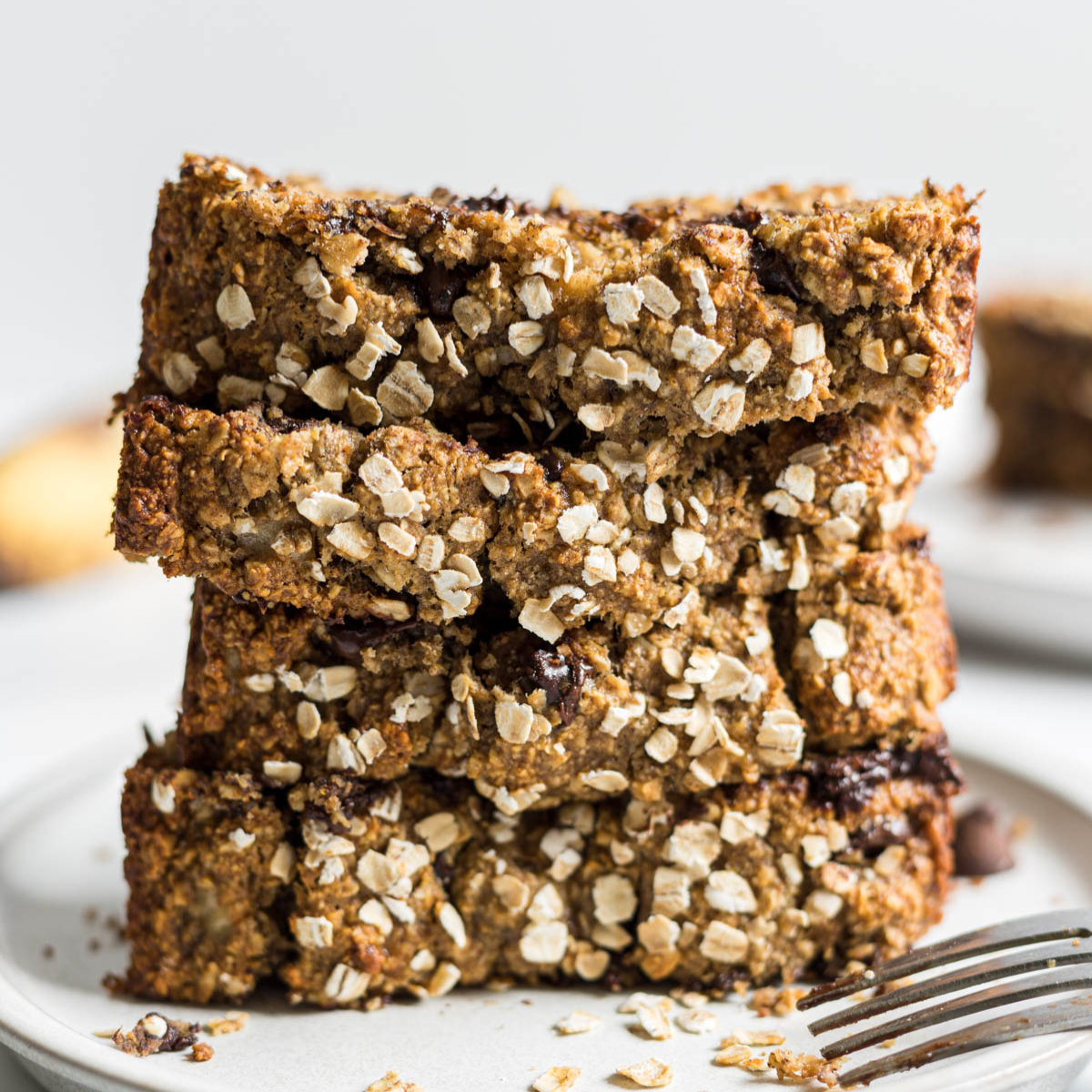 A stack of chocolate chip banana oatmeal bread slices.