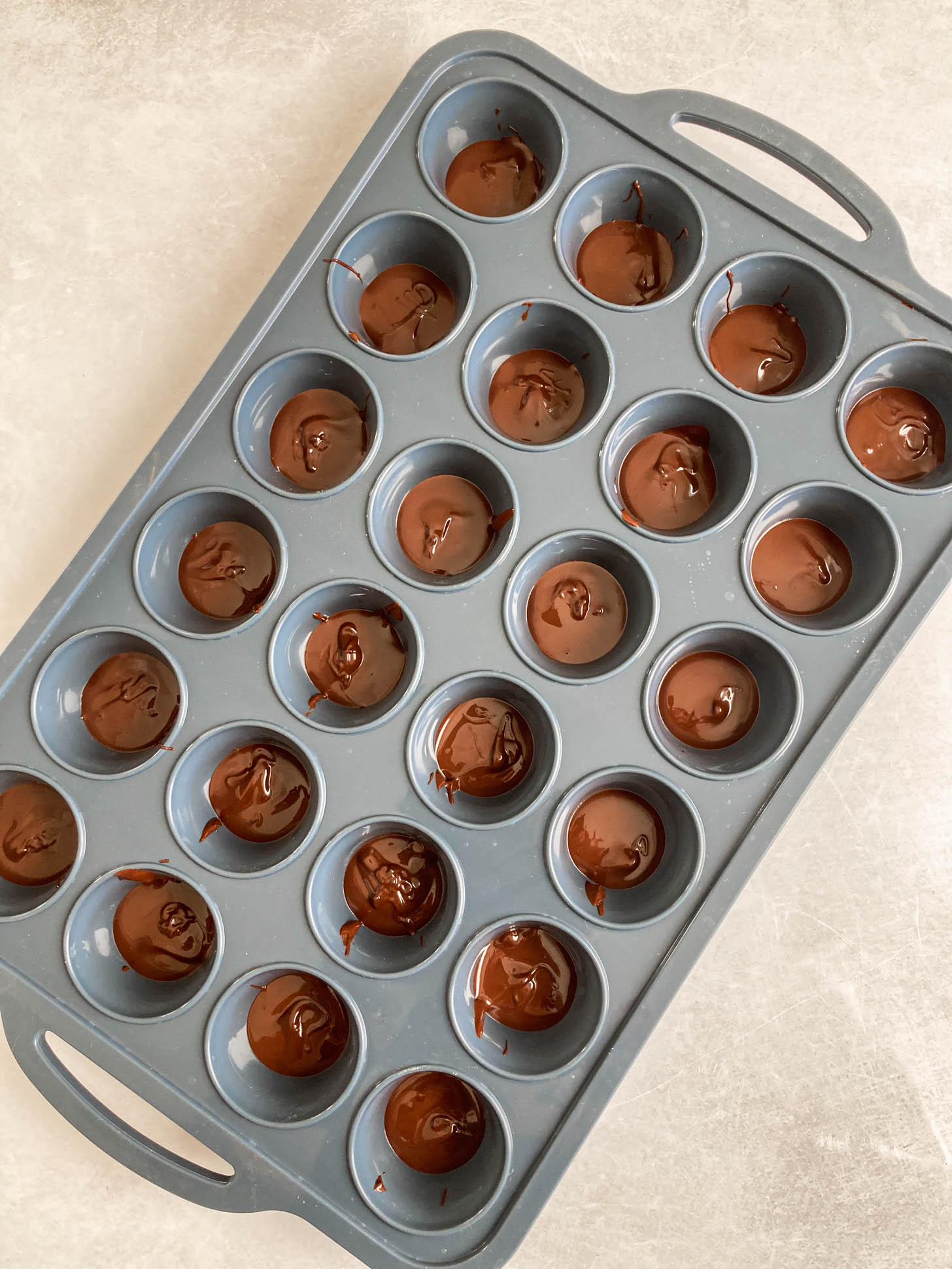 Melted chocolate in muffin pan.