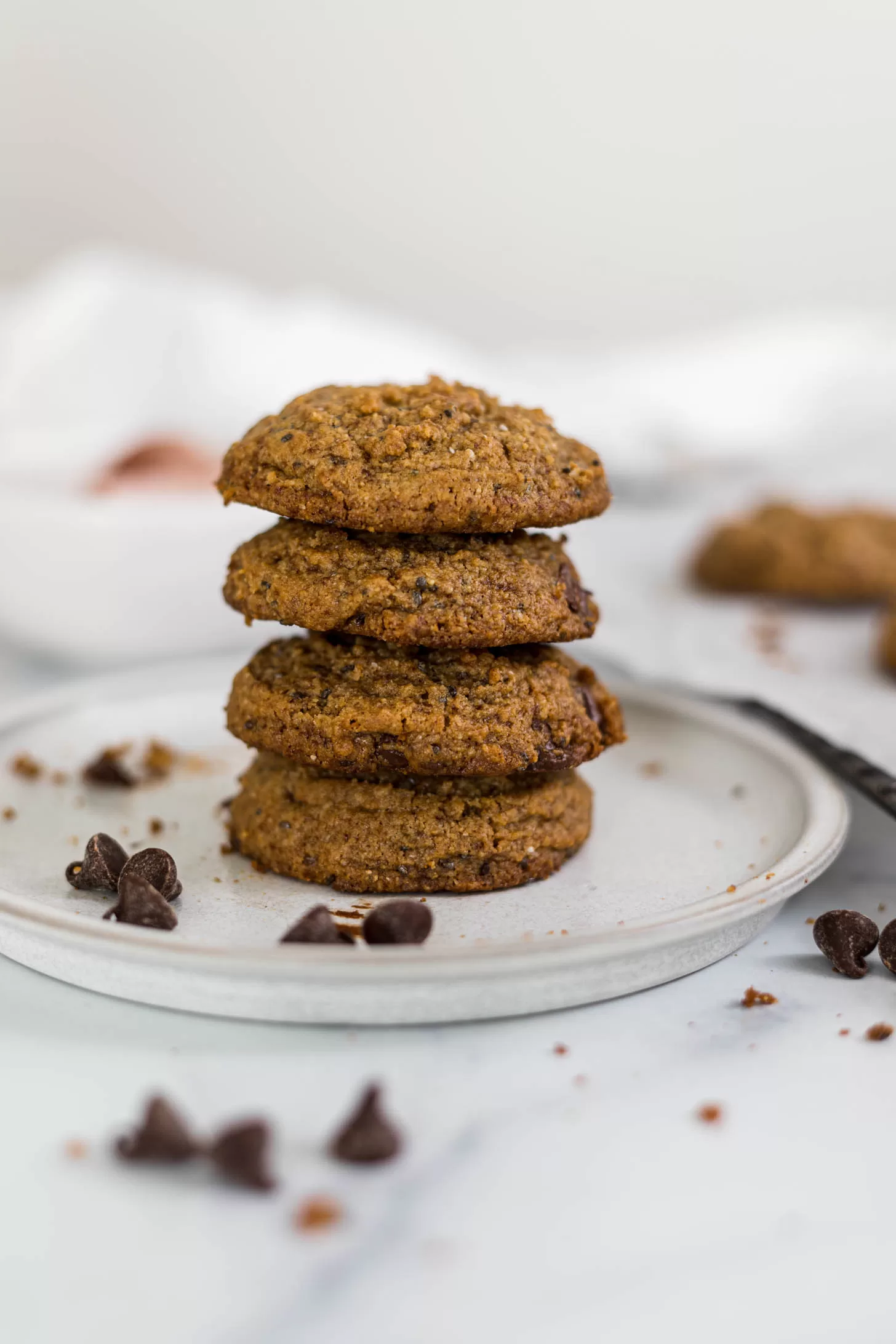 A stack of tahini cookies on a plate.