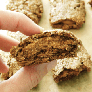 A close up of an Almond Butter Fig Bar that is cut in half.