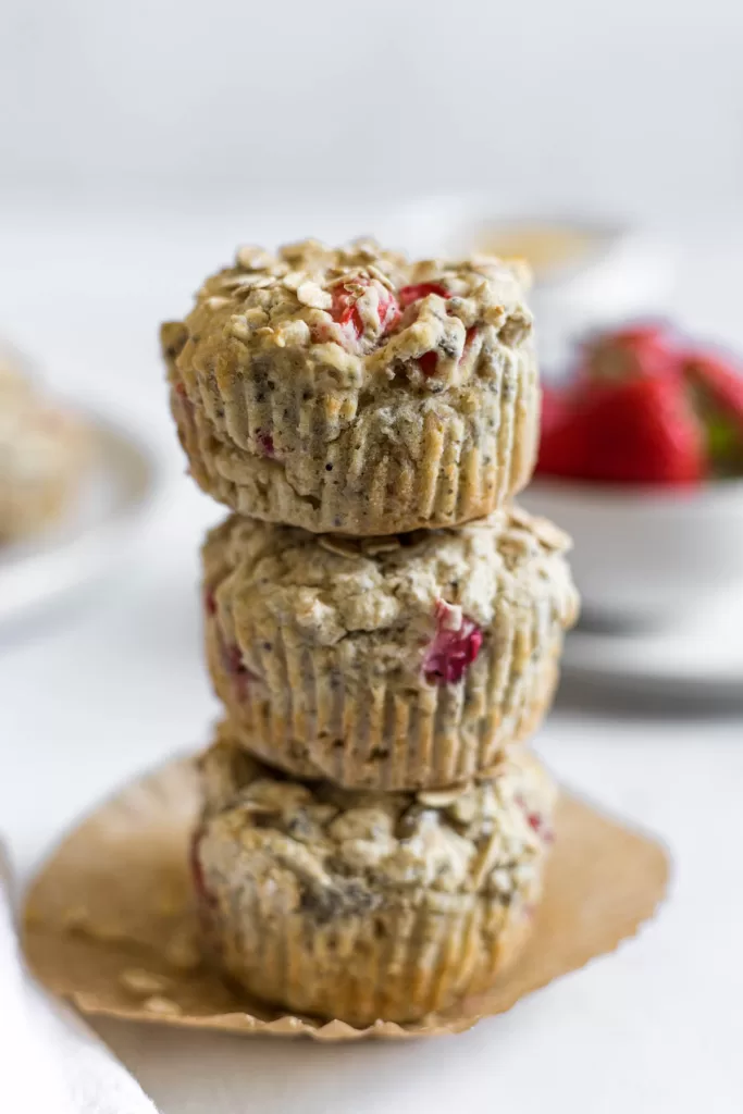 A stack of three strawberry muffins.