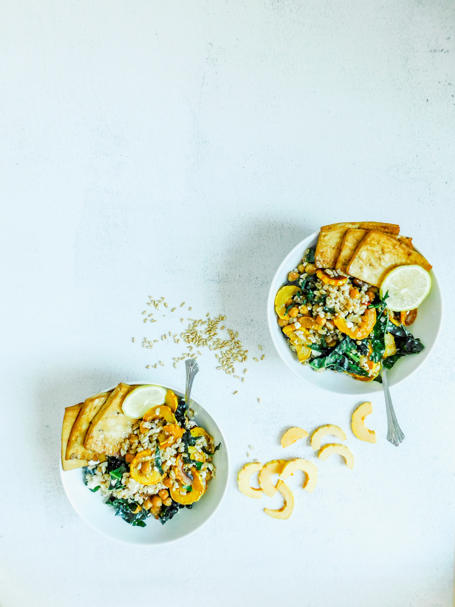 Two bowls of roasted squash salad.