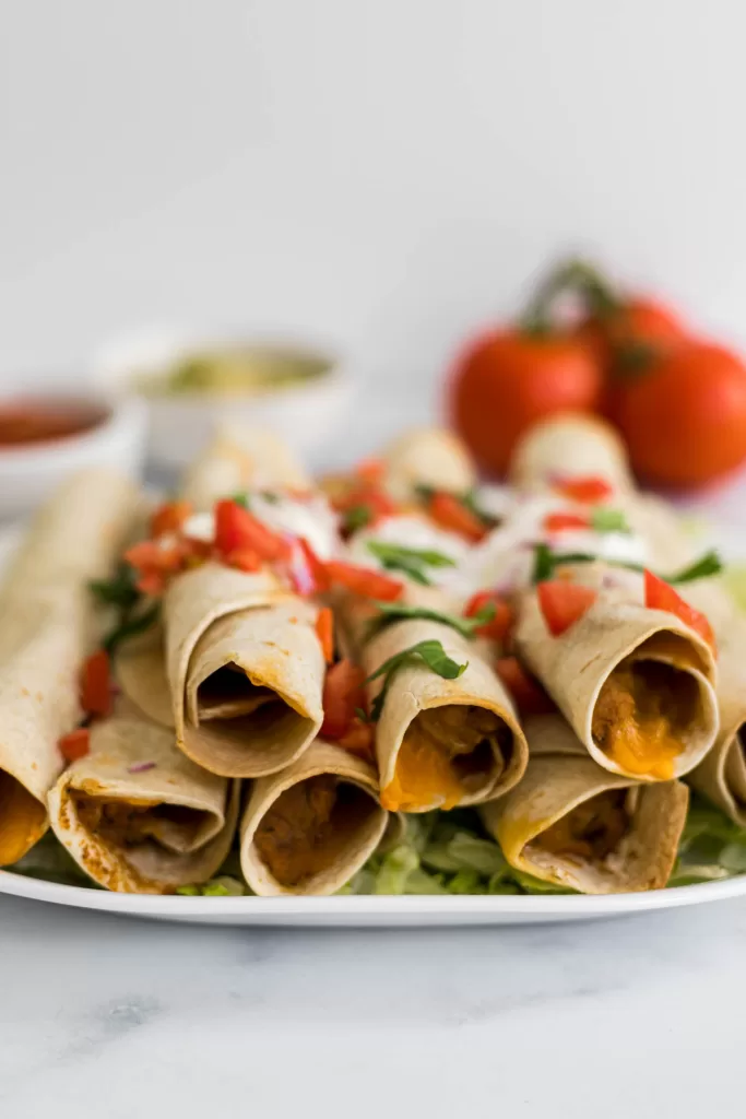 A side view of a stack of flautas.