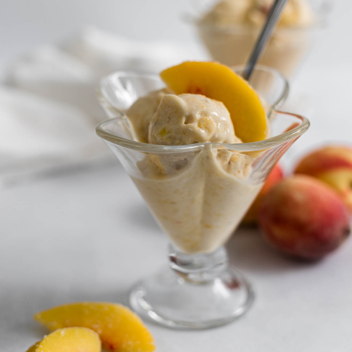 Peach Nice Cream in a glass cup.