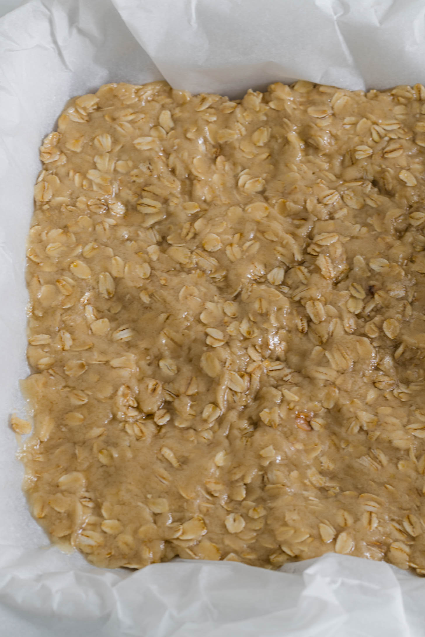 Dough is spread out in a baking dish.