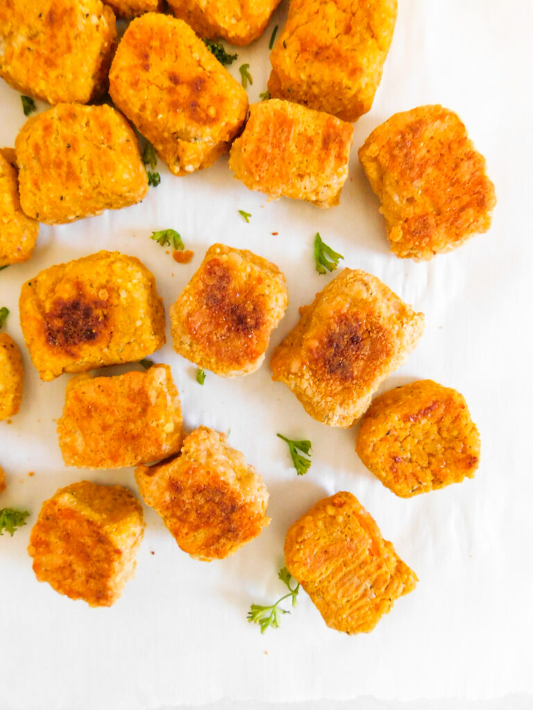 Some sweet potato tater tots scattered.
