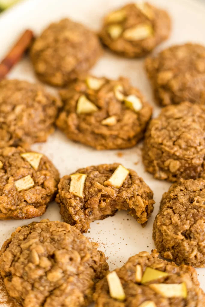 A close view of the cookies, one has a bite out of it.