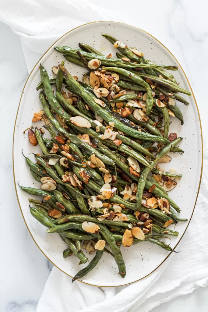 A plate of roasted green beans. 