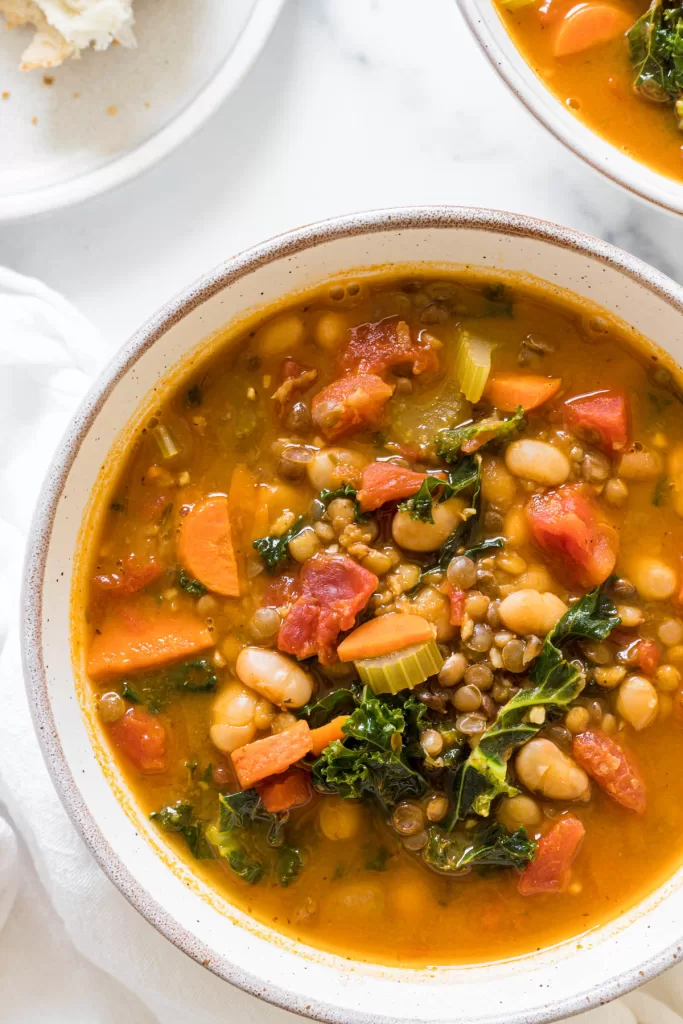 A close up view of white bean lentil soup.