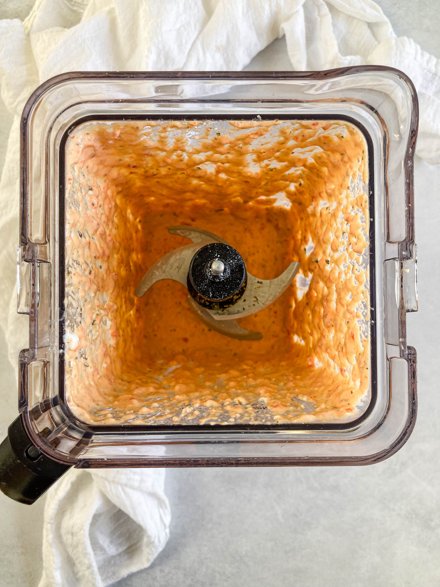 Roasted red bell pepper and feta sauce in a blender.