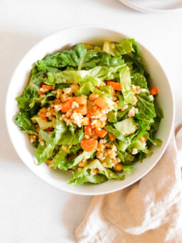 A bowl of Roasted Chickpea Salad With Tahini Dressing.