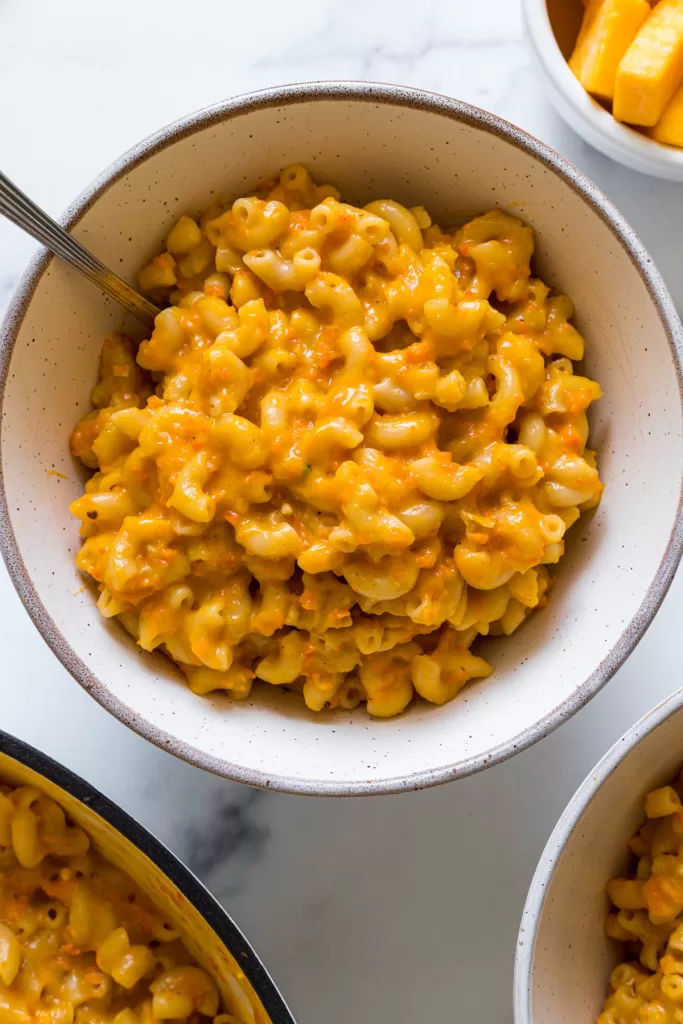 An overhead view of a bowl of healthy macaroni and cheese.
