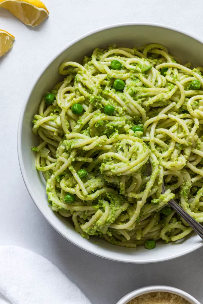 A bowl of green pea pasta. 