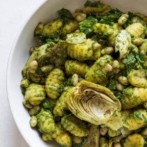 Pesto gnocchi in a serving bowl.