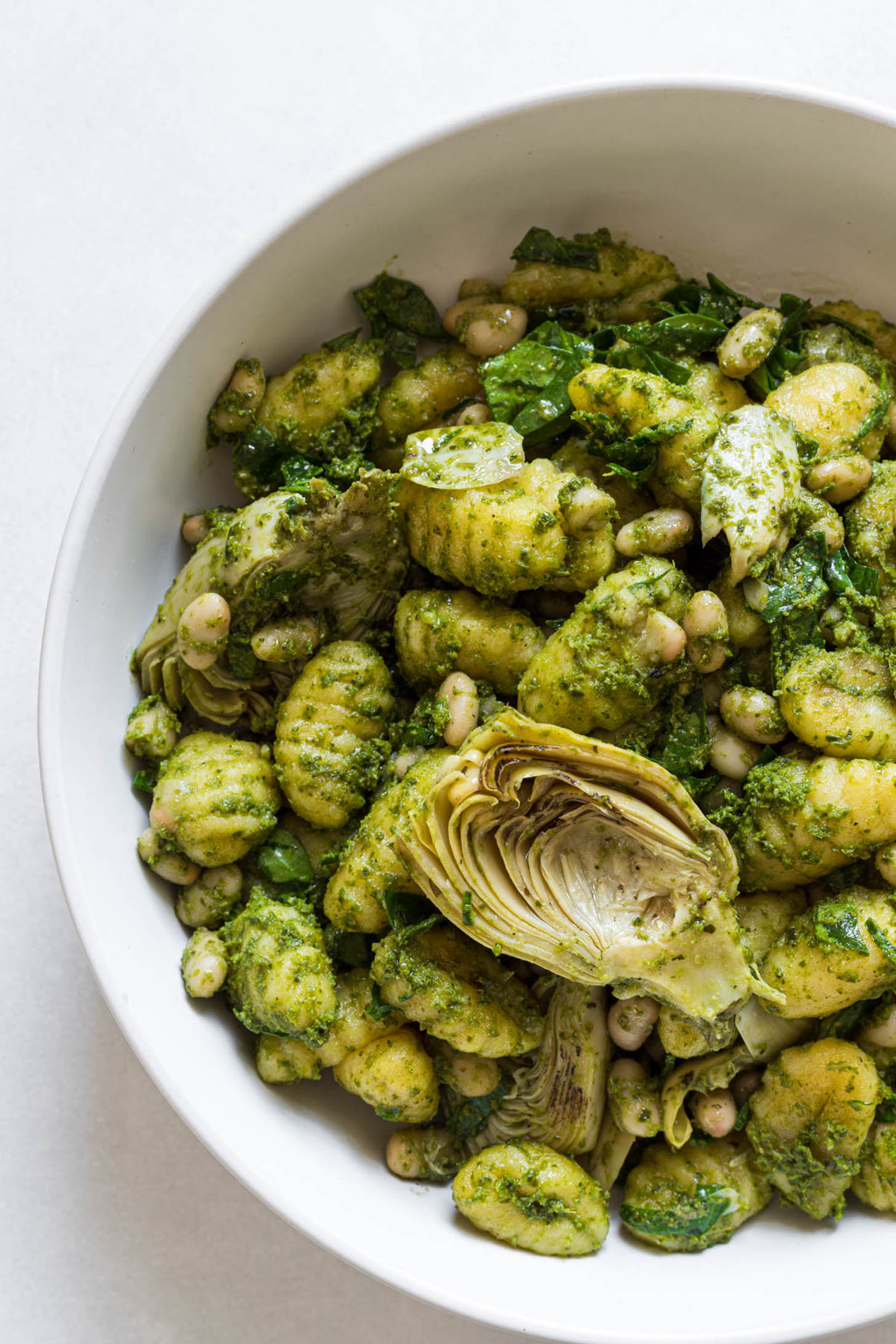 Pesto gnocchi in a serving bowl.