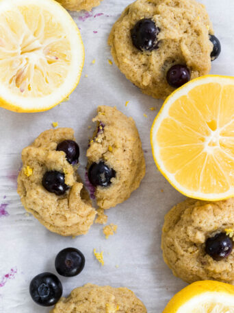 Lemon Blueberry Cookies with lemon halves next to them.