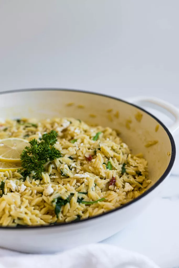 A side view of orzo in a pan. 