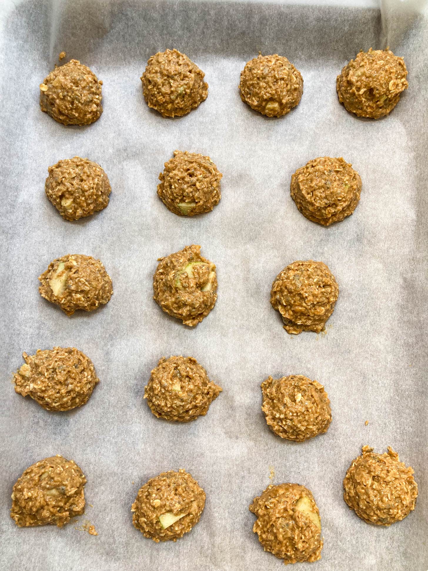 Uncooked cookies on a baking sheet.