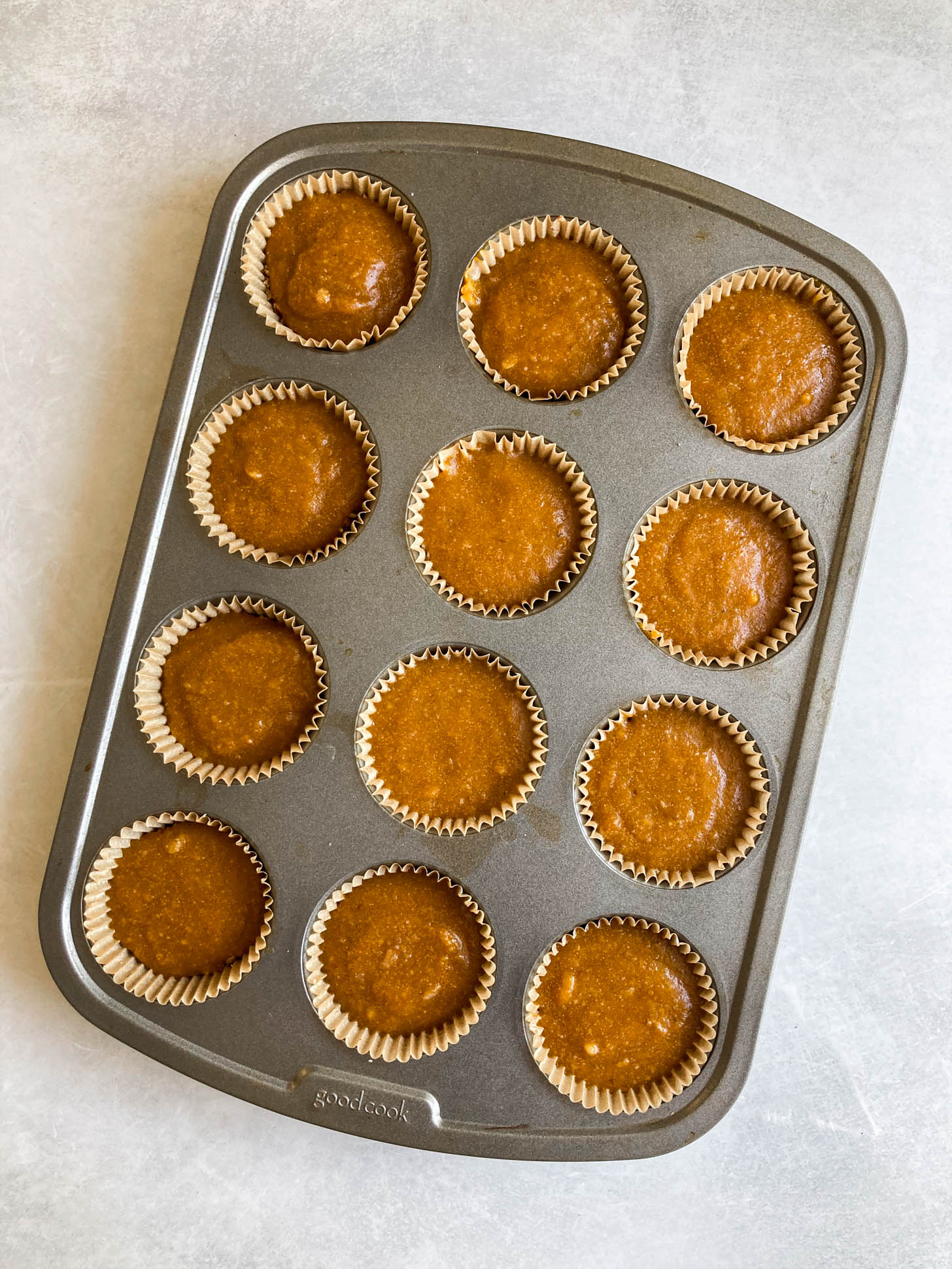 Pumpkin tart assembled in a muffin pan.