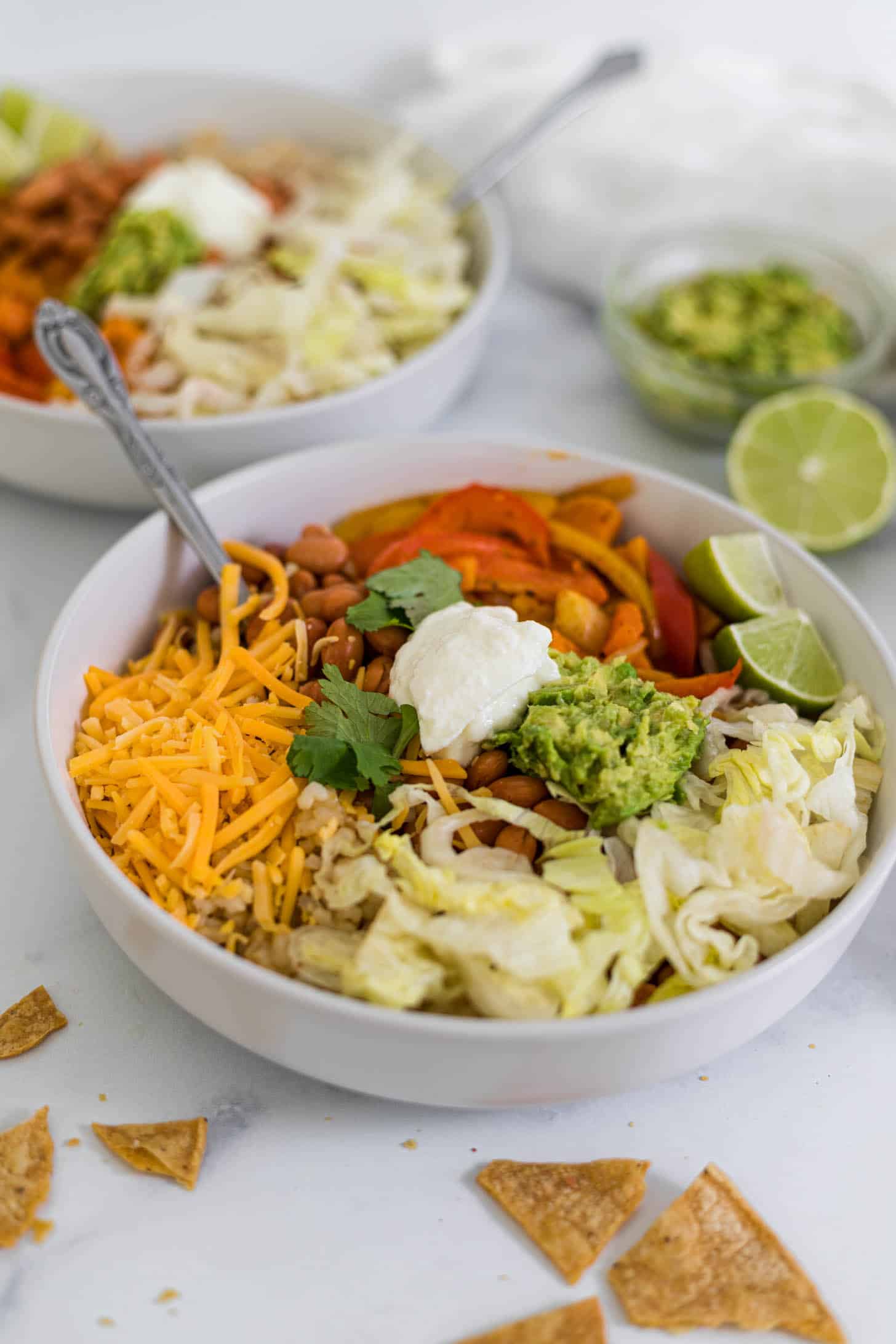 Two bowls of fajita bowls.