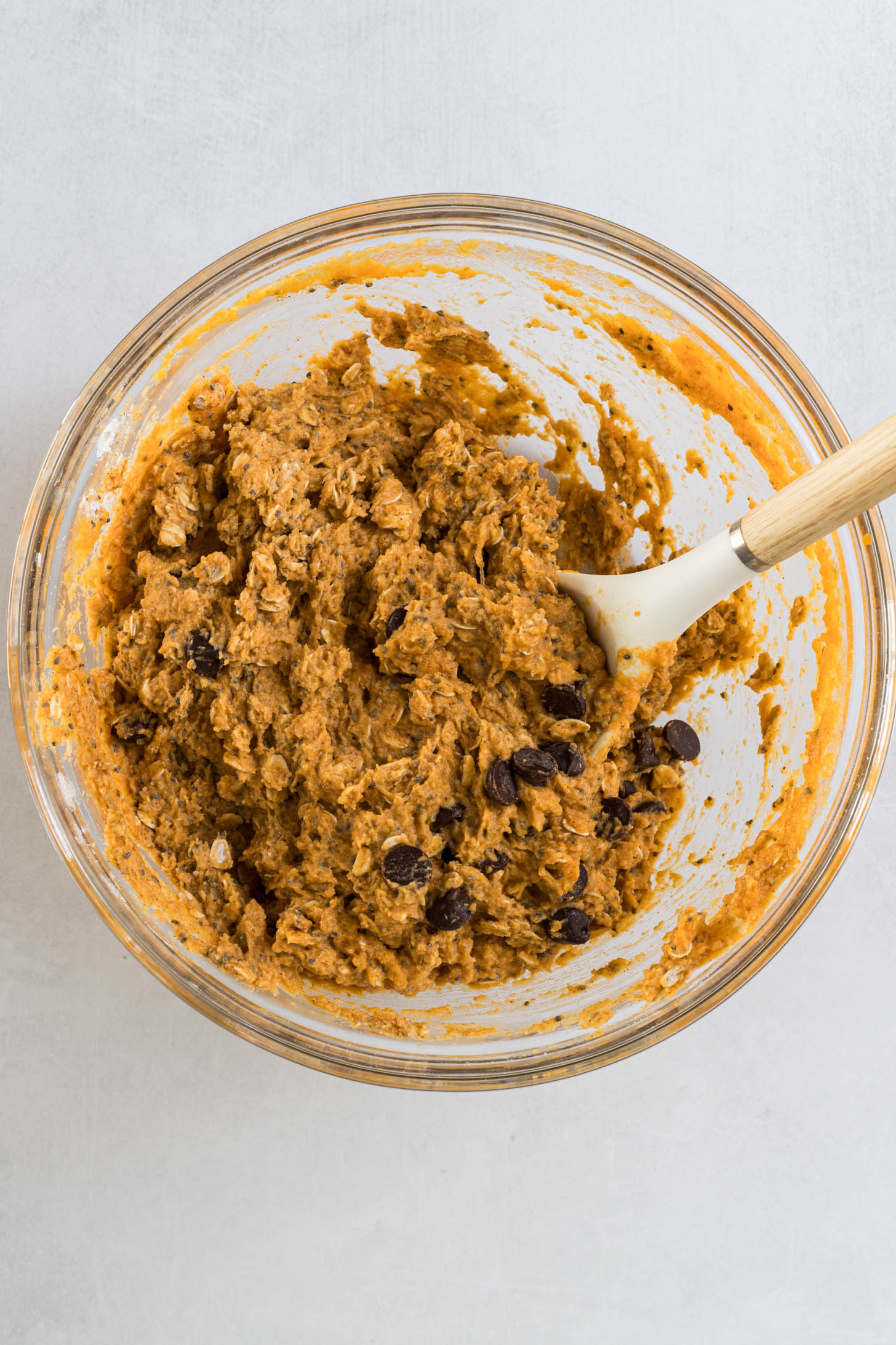 Wet and dry ingredients mixed together in a bowl.