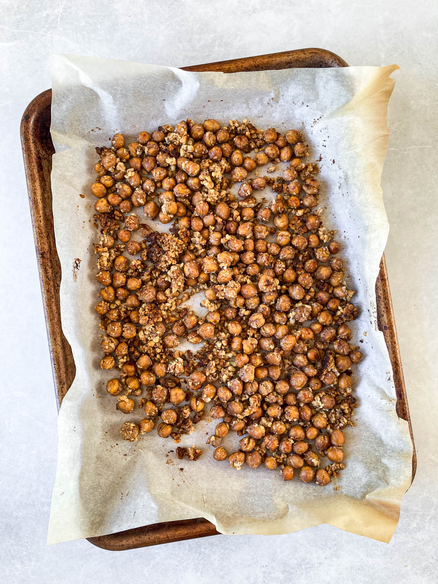 Roasted chickpeas on a baking sheet.