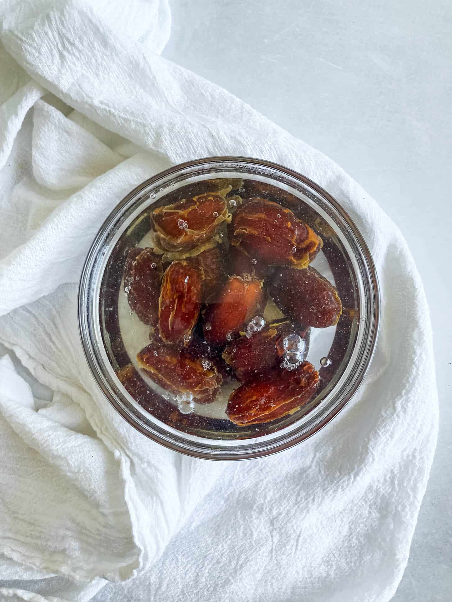Dates soaking in hot water.