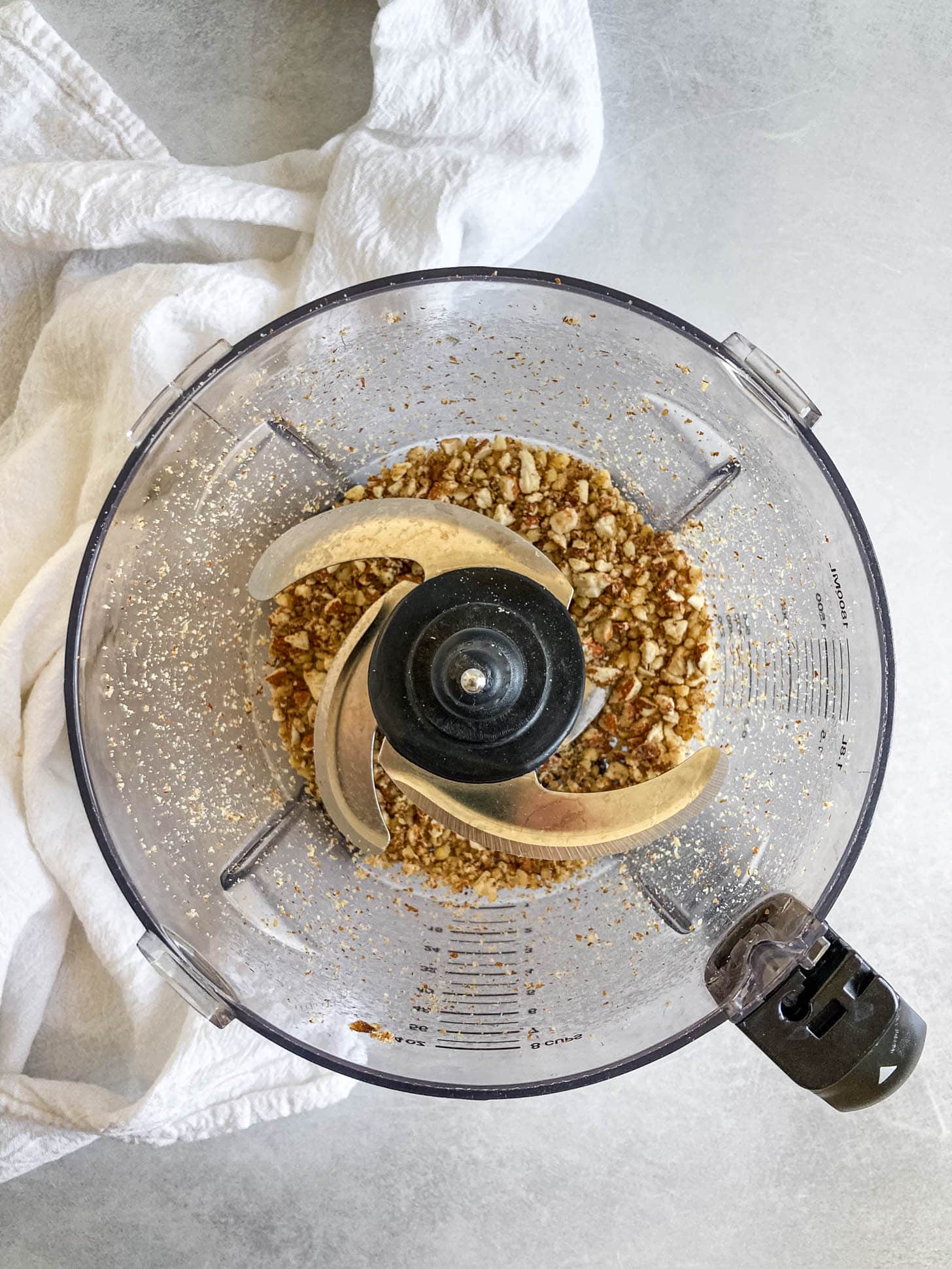 Walnuts and almonds processed in a food processor.