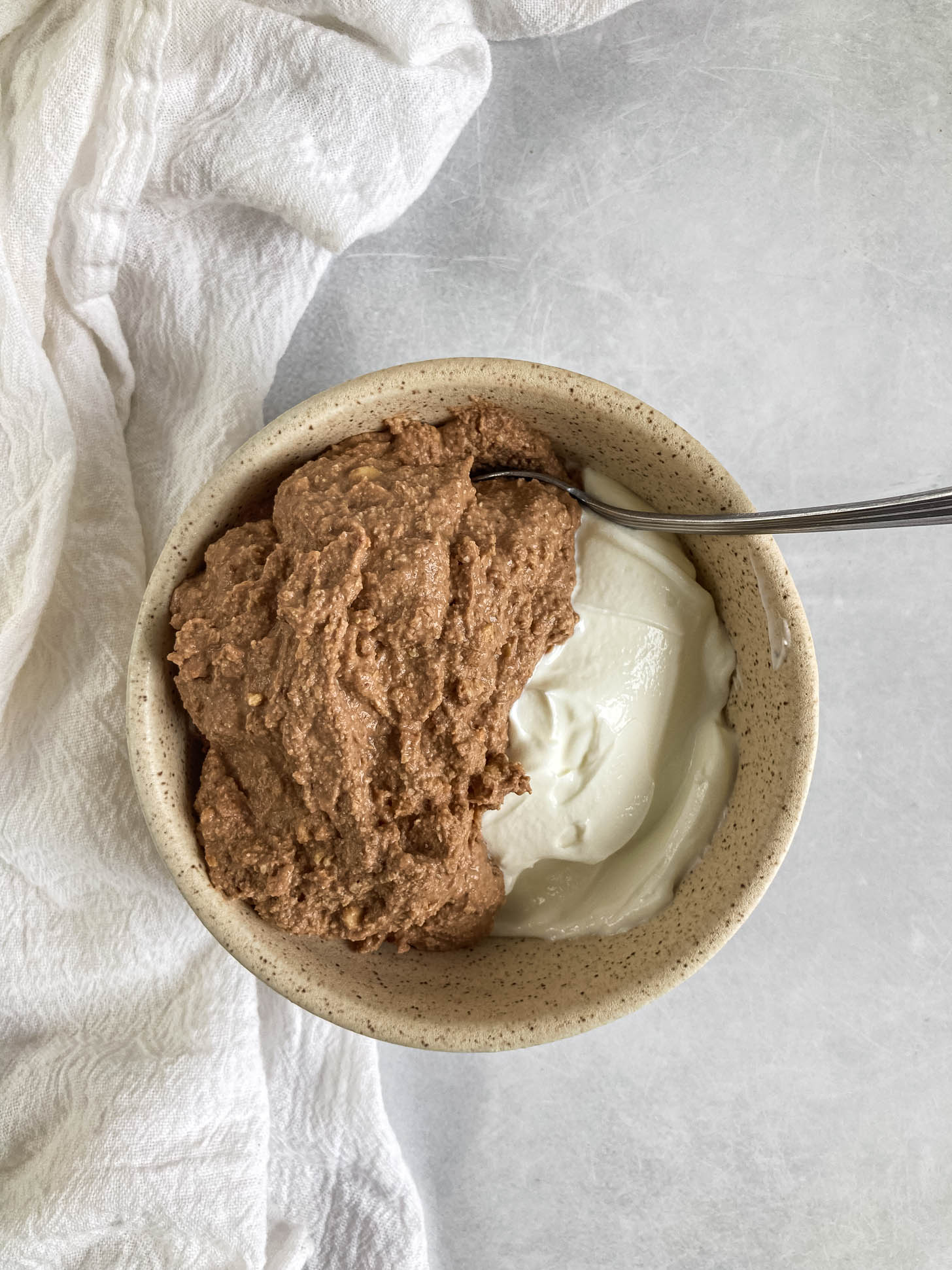 Chocolate hazelnut mixture on top of yogurt.