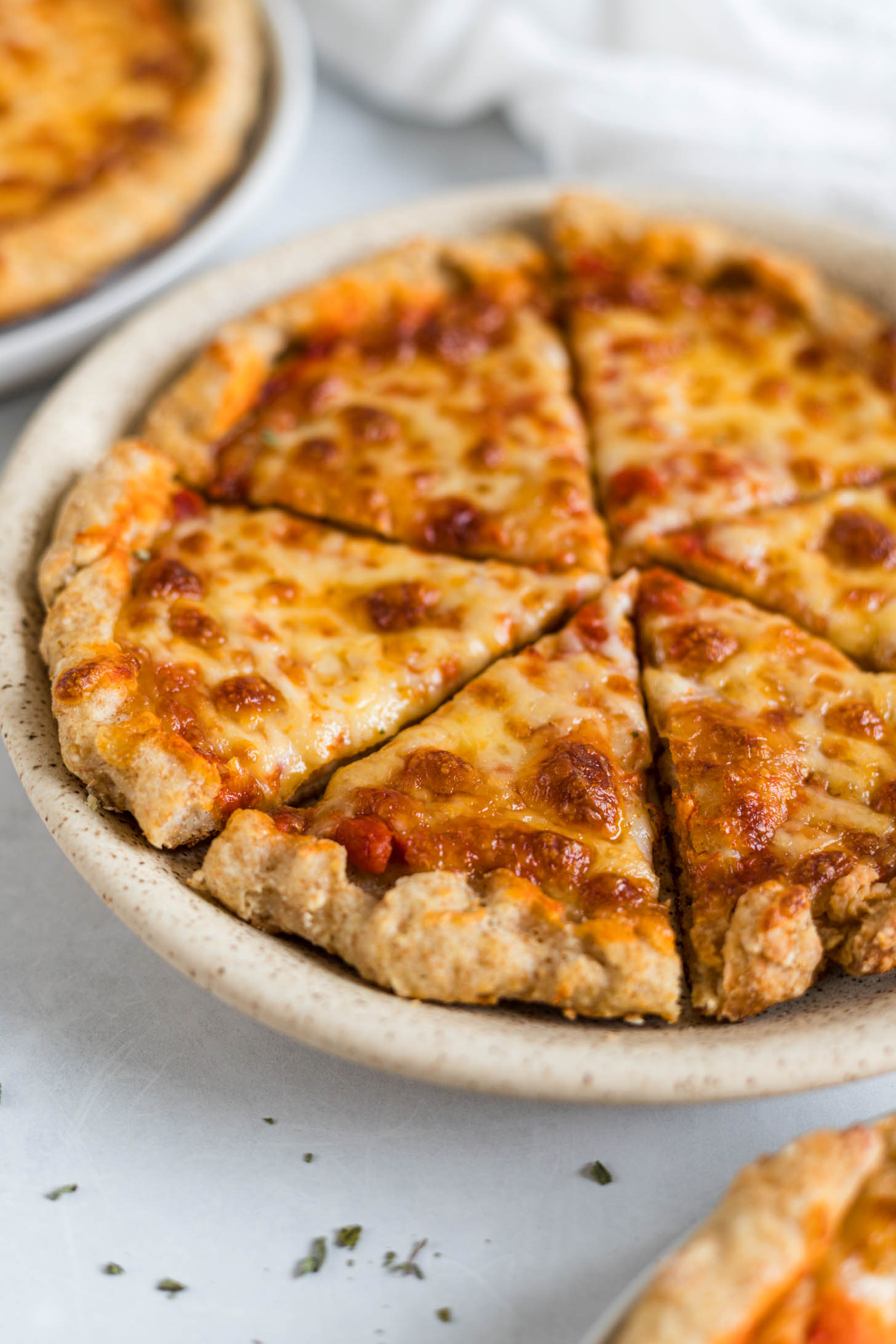 Cheese pizza on a plate.