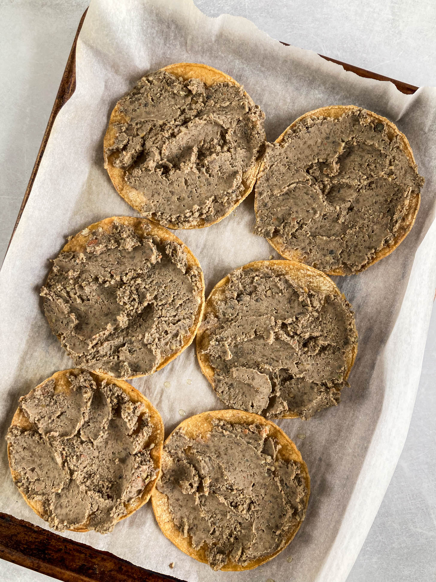 Lentil and bean mixture on baked tortillas.