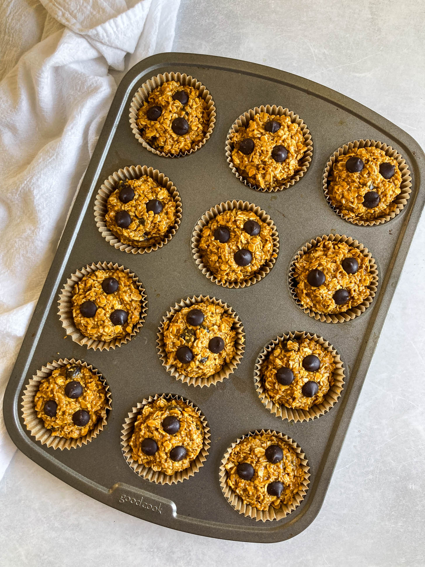 Muffin batter in a muffin tray.