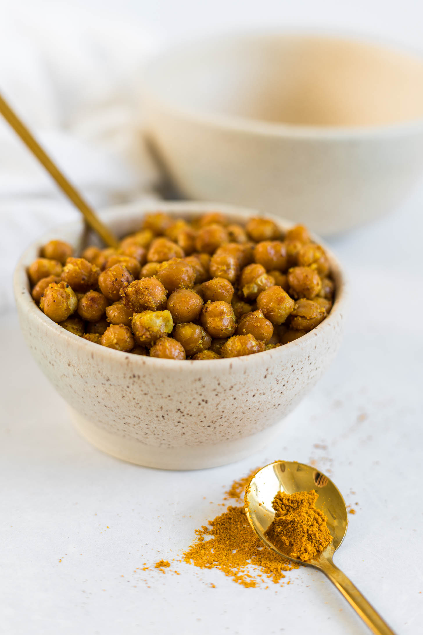 Roasted chickpeas with curry powder in a bowl.