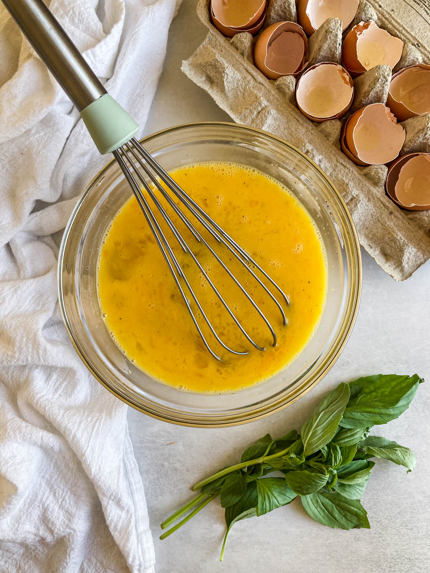 Eggs scrambled in a bowl.