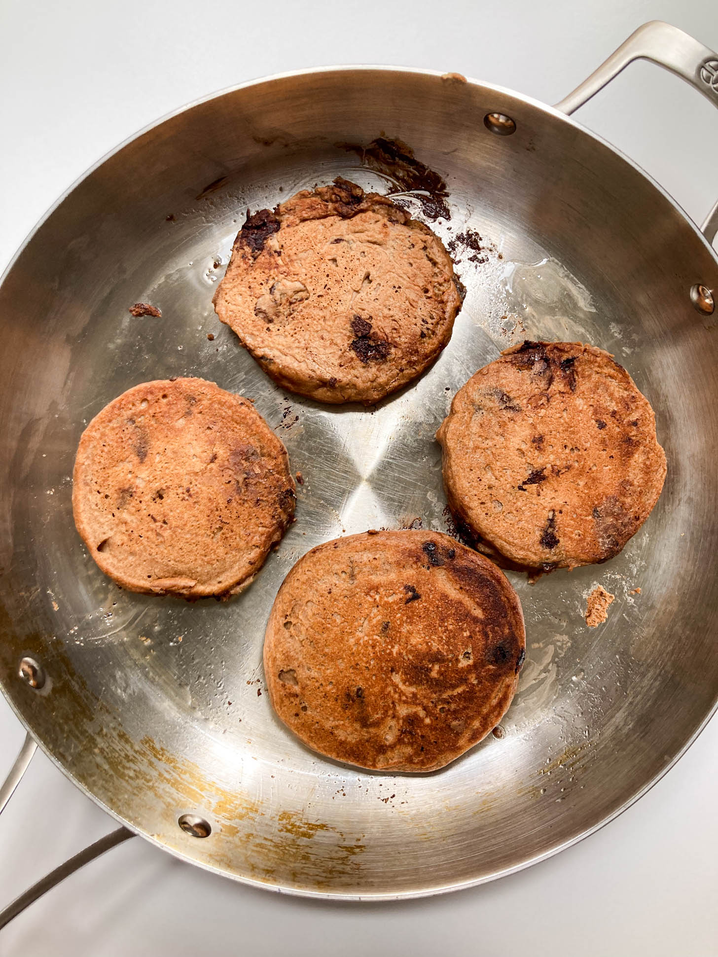 Pancakes flipped in a pan.