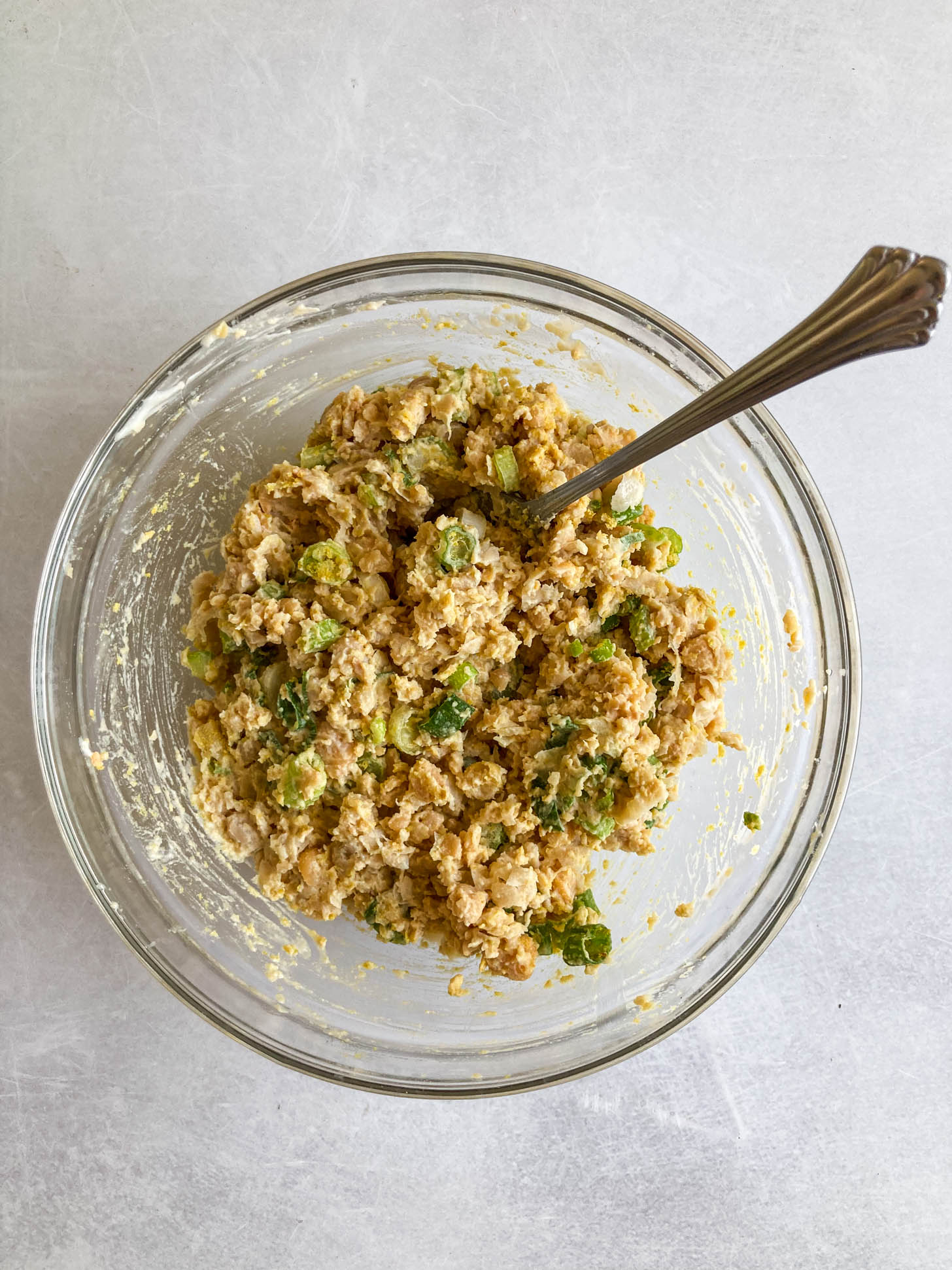 Other chickpea salad ingredients added to the bowl.