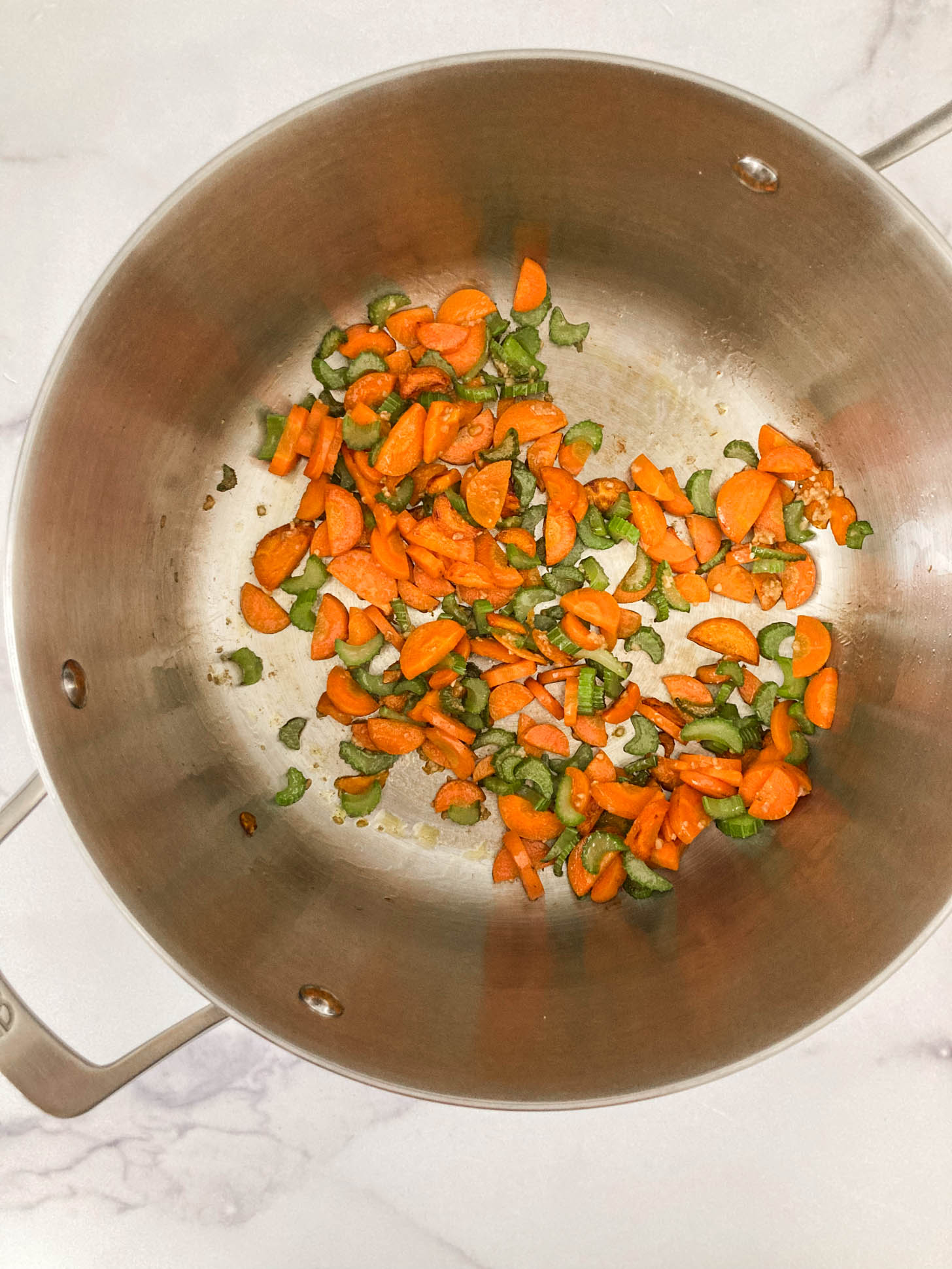 Celery and carrots in a large pot.