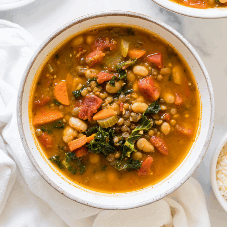 White bean and kale soup in a bowl.