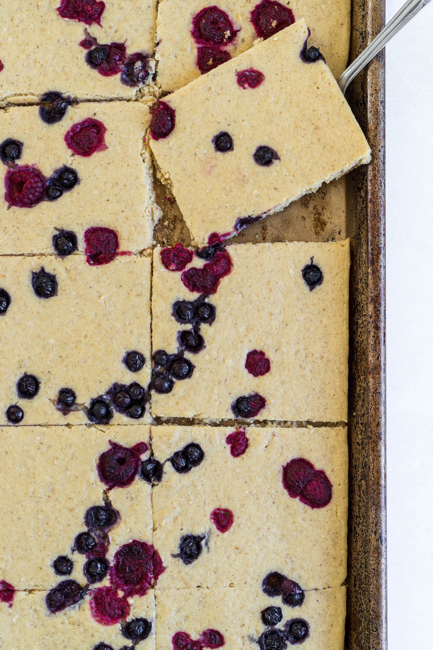 Pancakes sliced on the baking sheet.