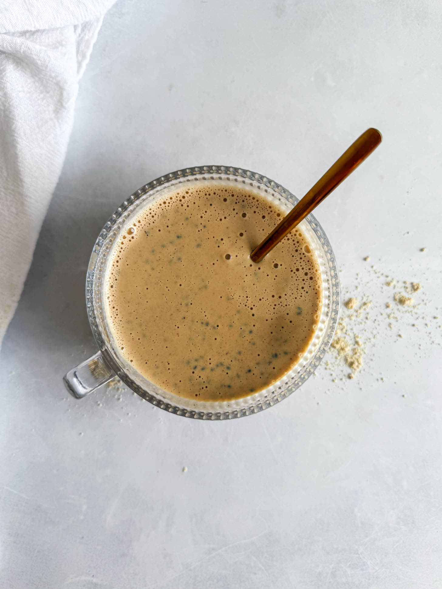 Blended ingredients poured over basil seeds.