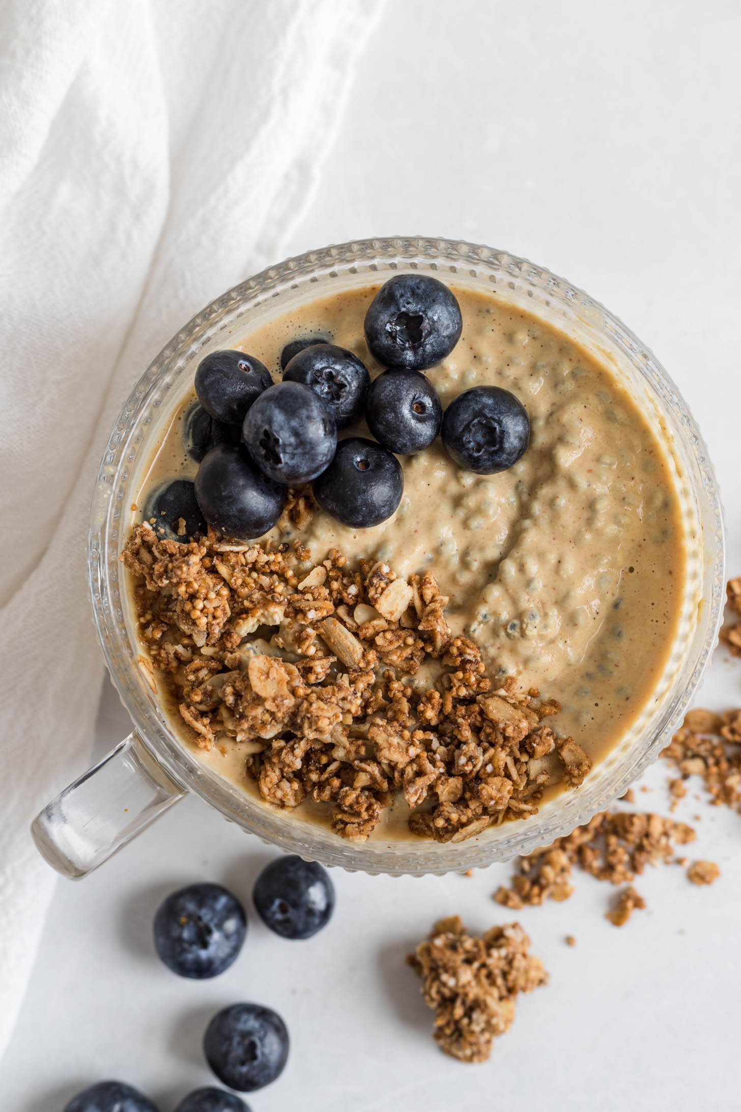 Basil pudding with granola and blueberries.