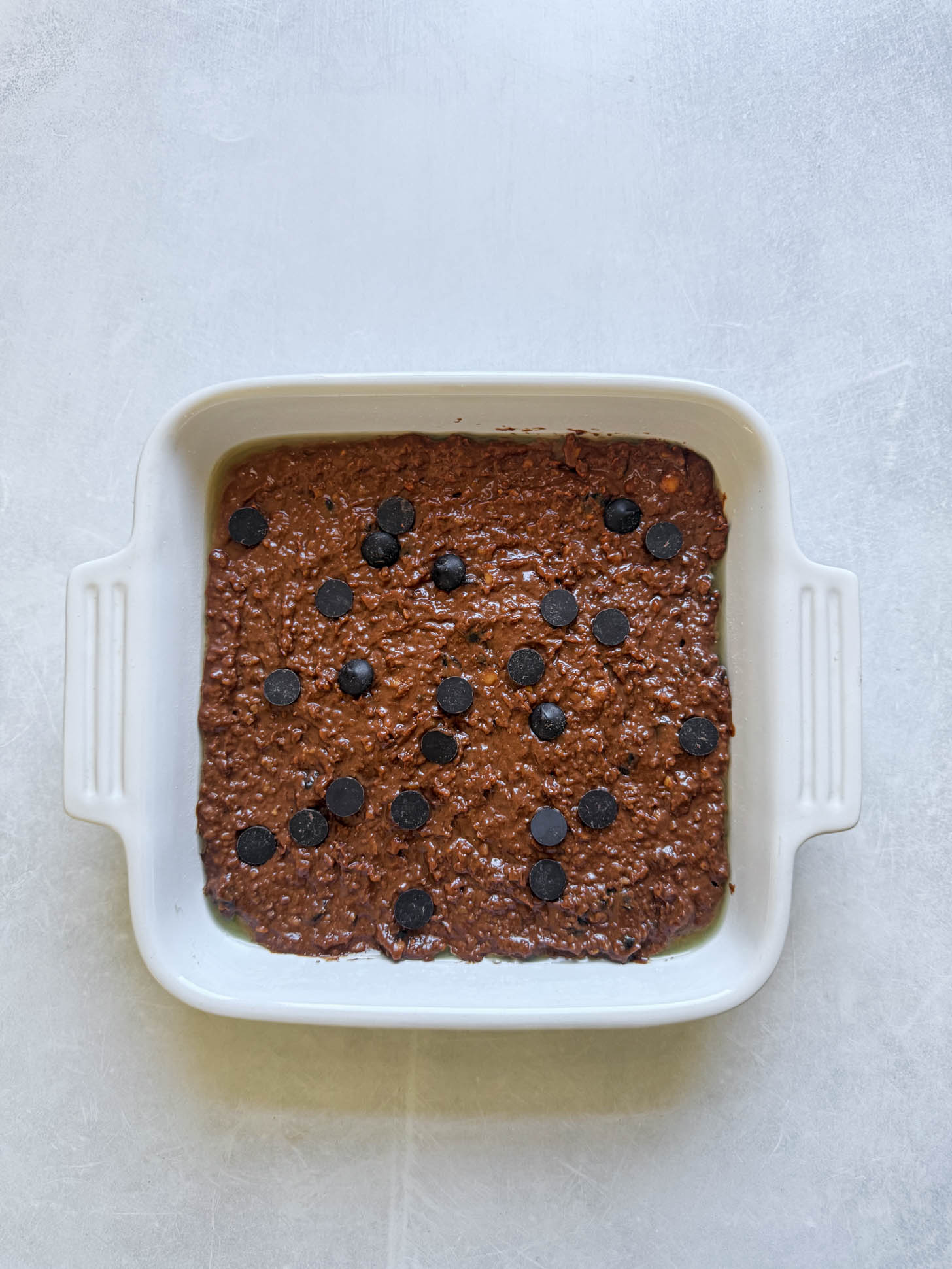 Brownie batter in a baking dish.