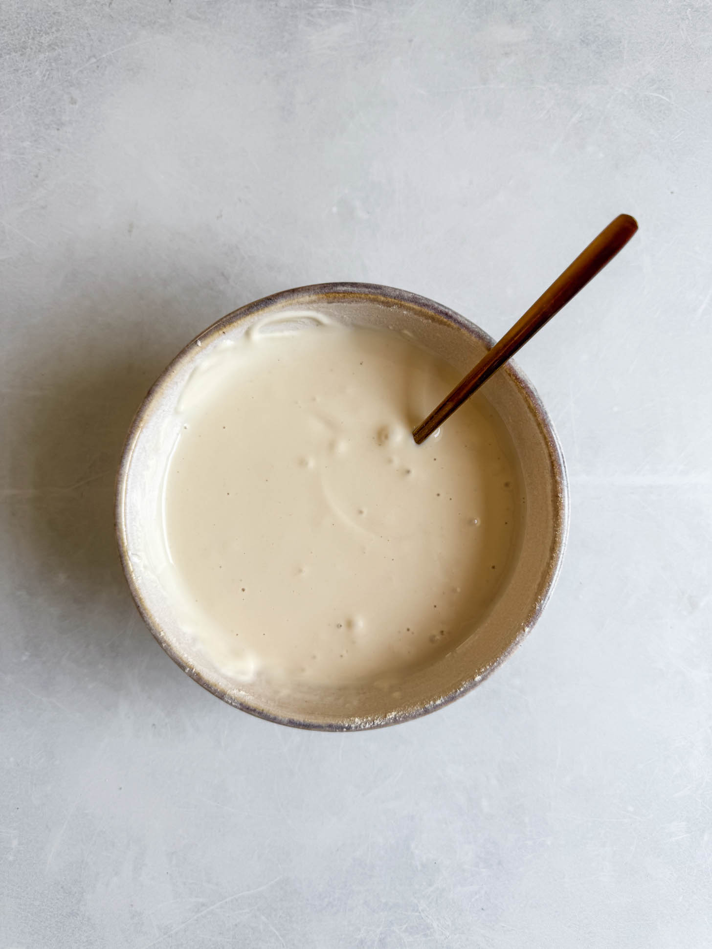 Yogurt mixed with milk.