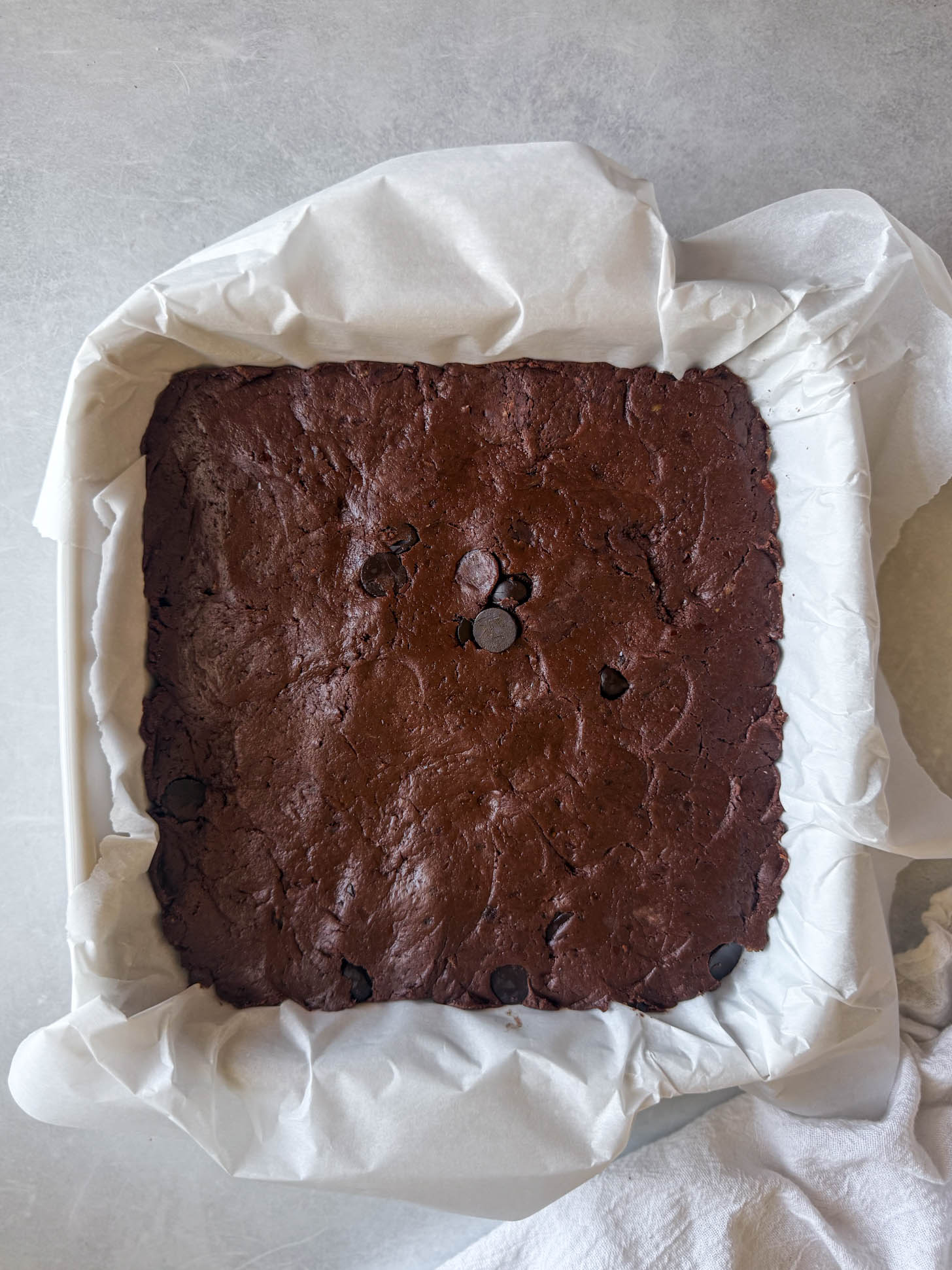 Brownie batter in a baking dish.