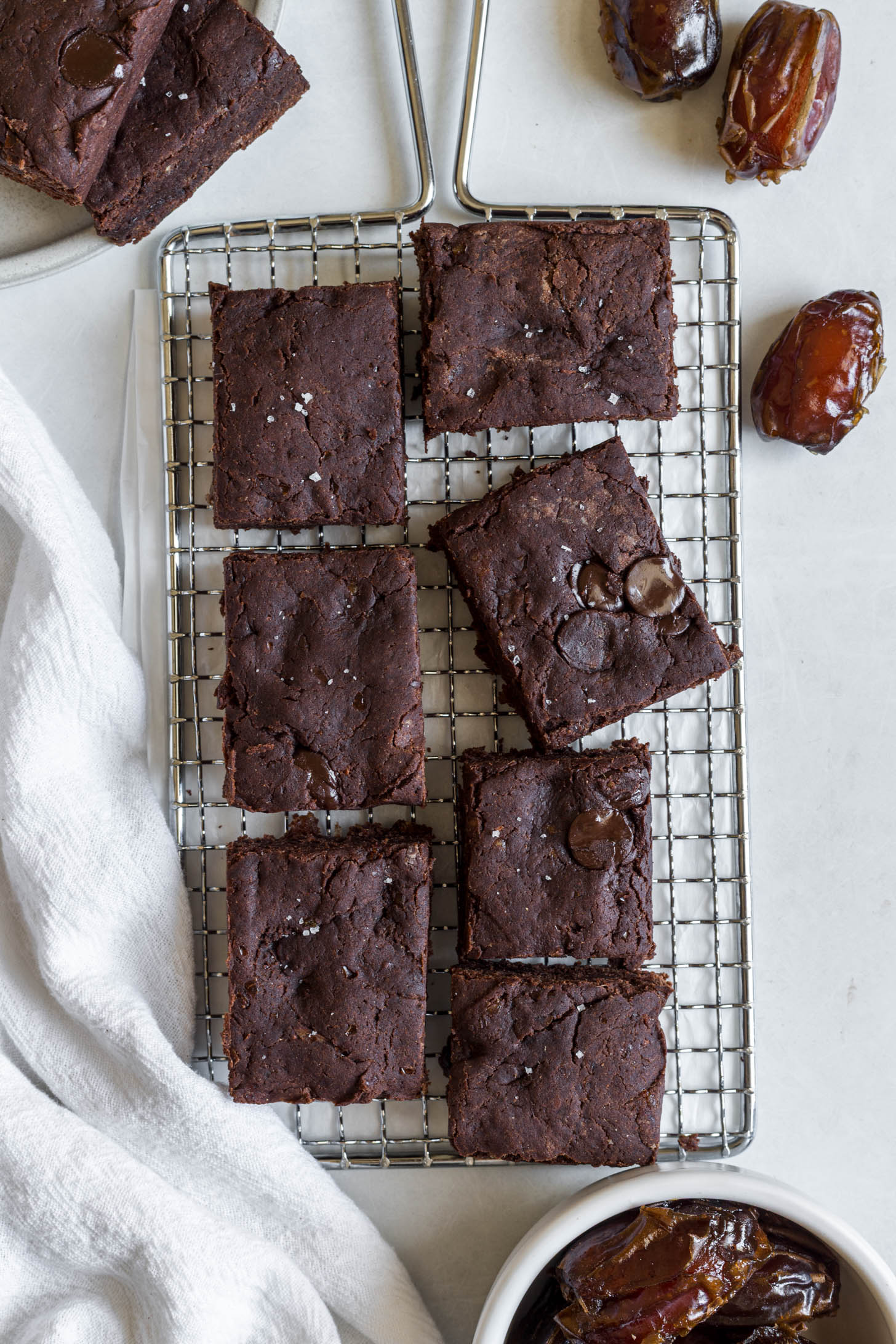 Date brownies on a wire rack.