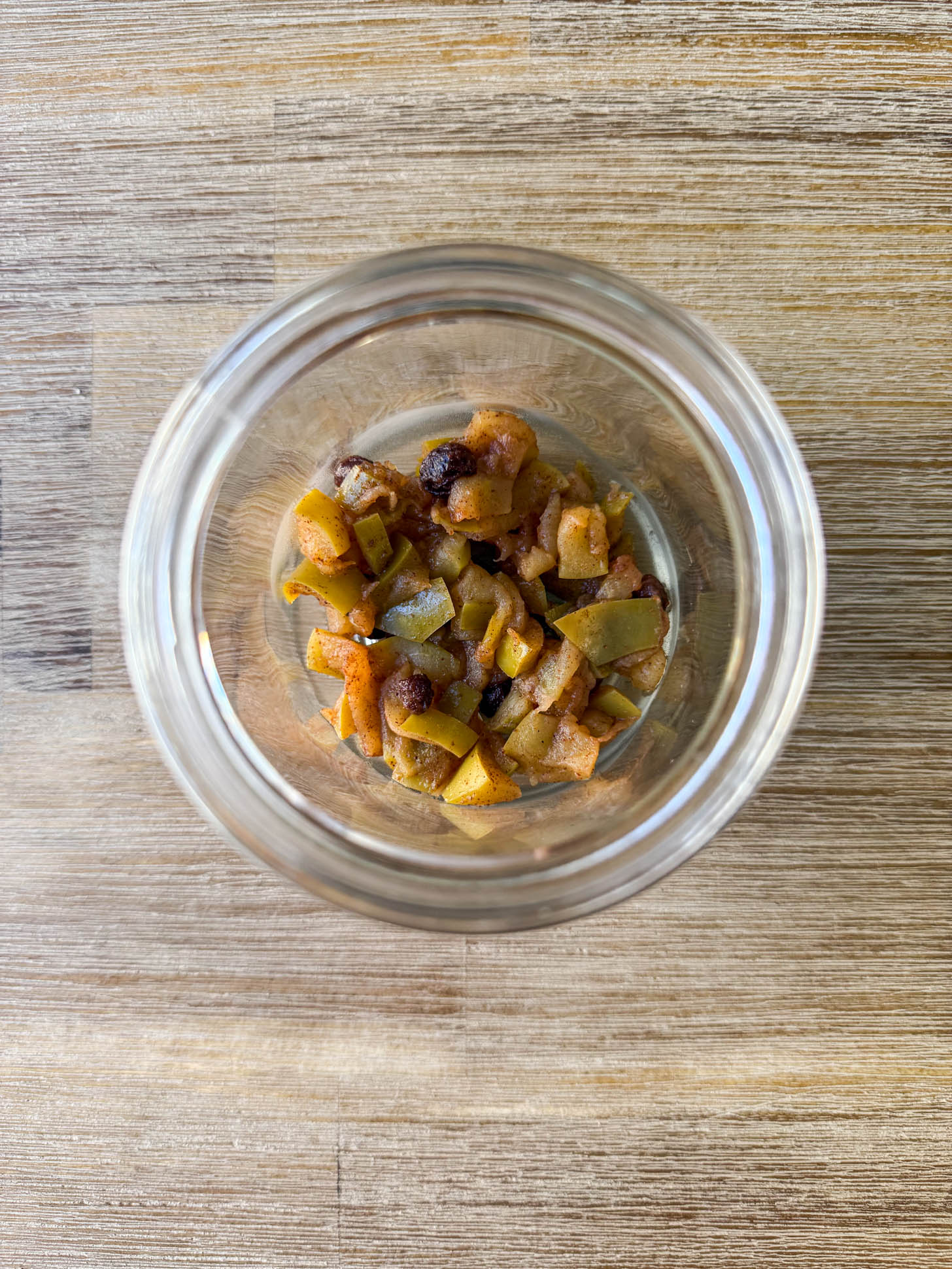Apple compote layered on the bottom of the parfait jar.