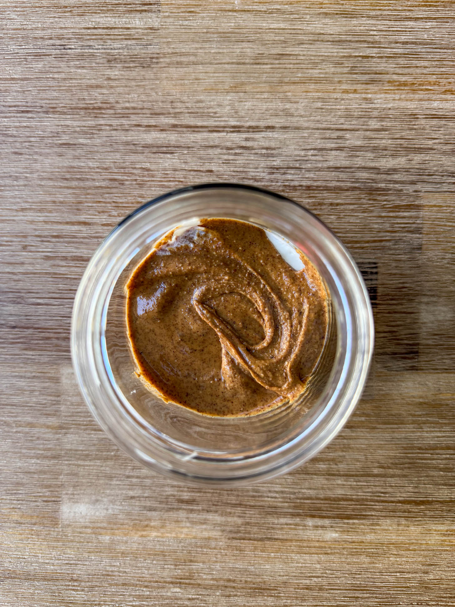 Almond butter layered in the jar.