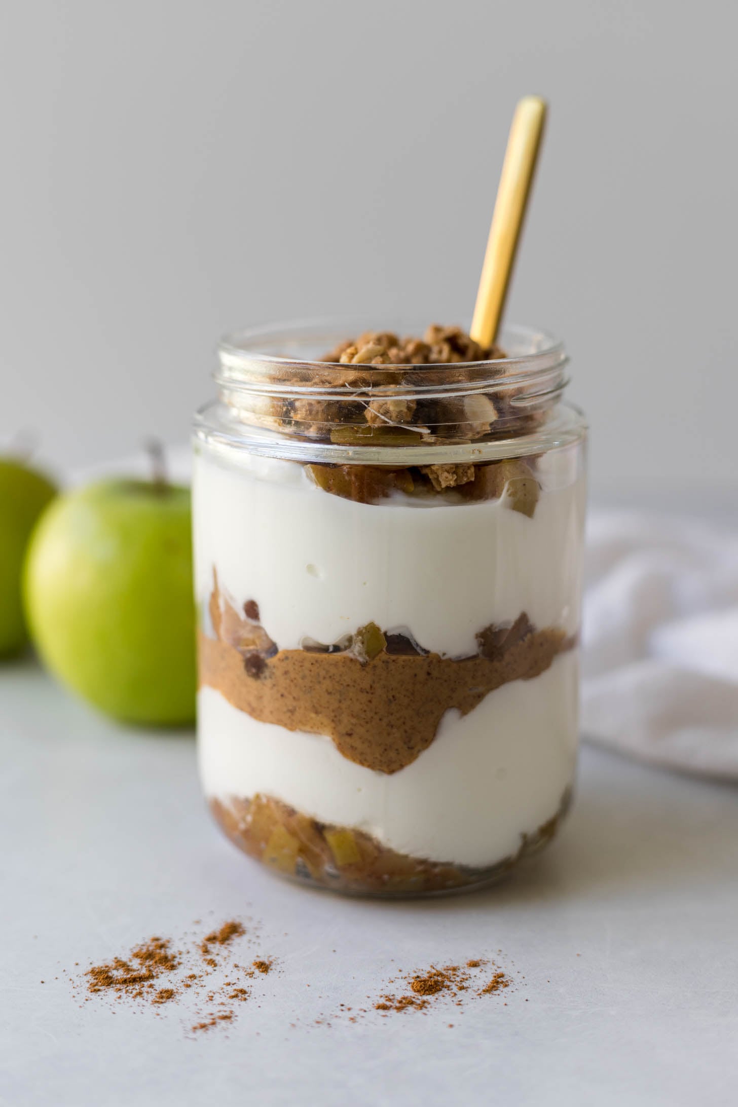 Apple pie yogurt layered in a meal prep jar.