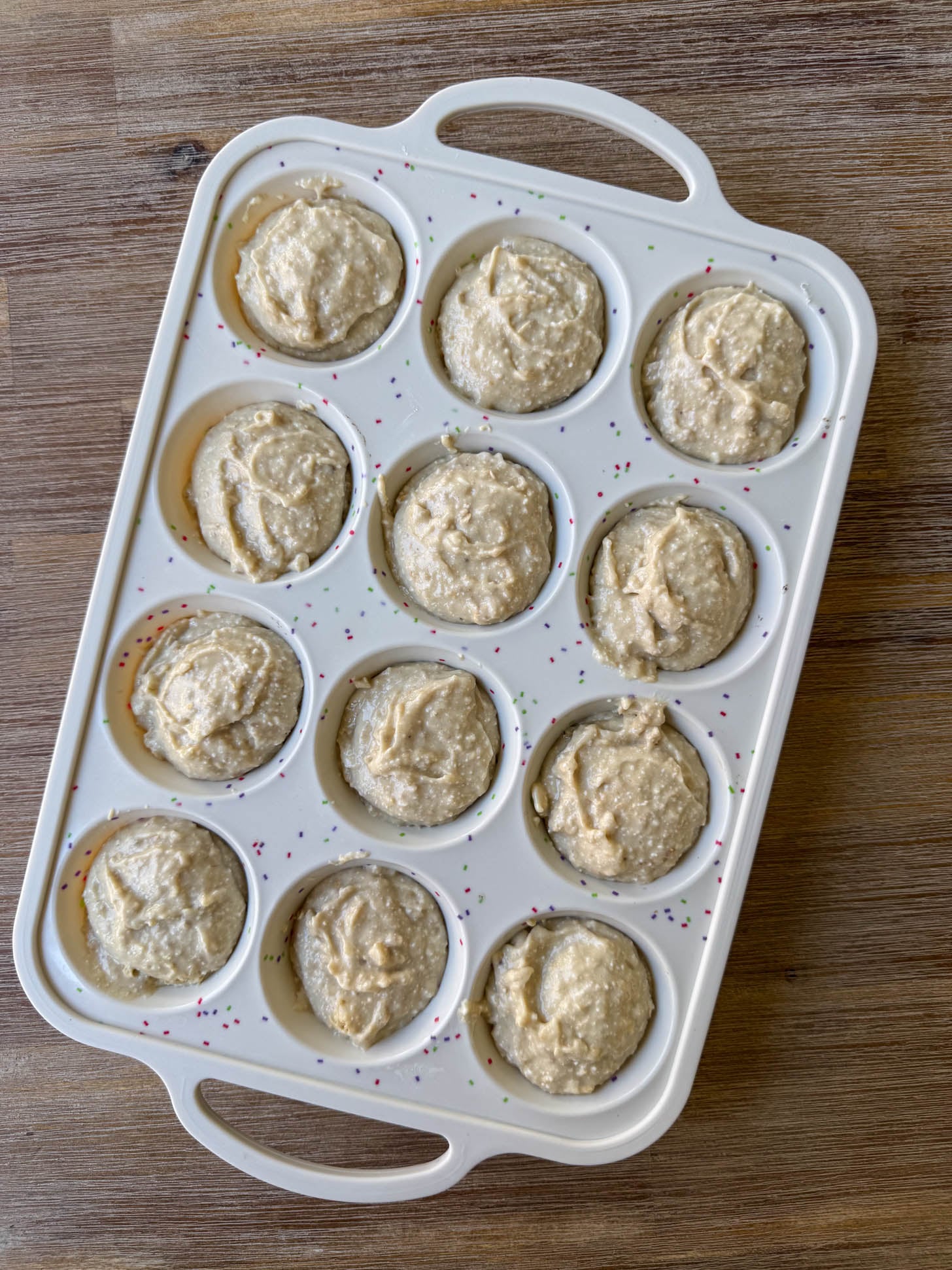 Batter in a muffin tray.